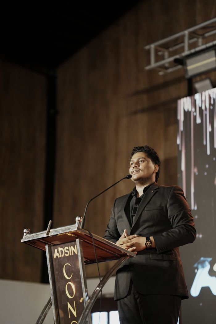Jasim CP speaking at the podium during the Adsin Conclave