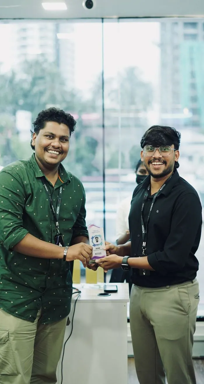 Jasim CP receiving a token of appreciation as supporting mentor at Adsin Learning Hub